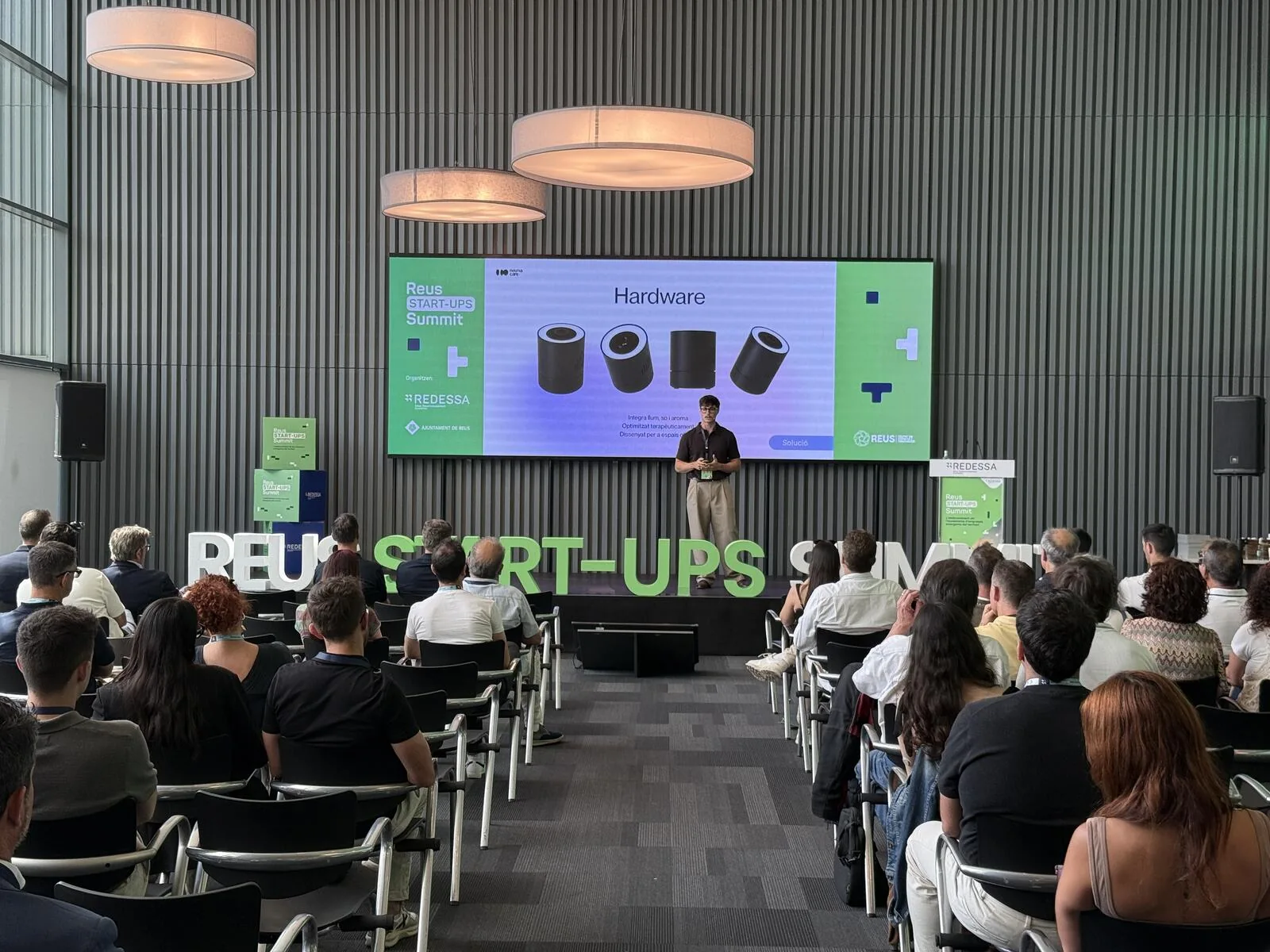 NeumaCare presenting on the Reus Start-Ups Summit stage